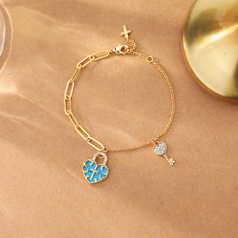 Christianartworkshop Bracciale con lucchetto a forma di cuore con croce turchese e chiave in zirconia - Bracciale con lucchetto a forma di cuore incrociato - image 0