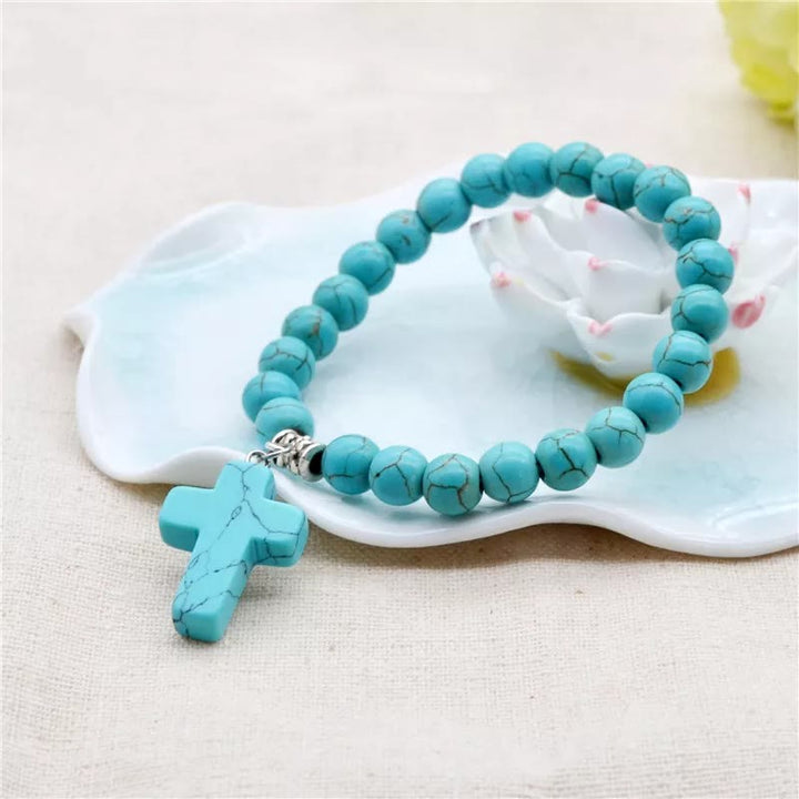 Bracciale con crocifisso in perline turchesi opache e satinate Christianartworkshop - image 3