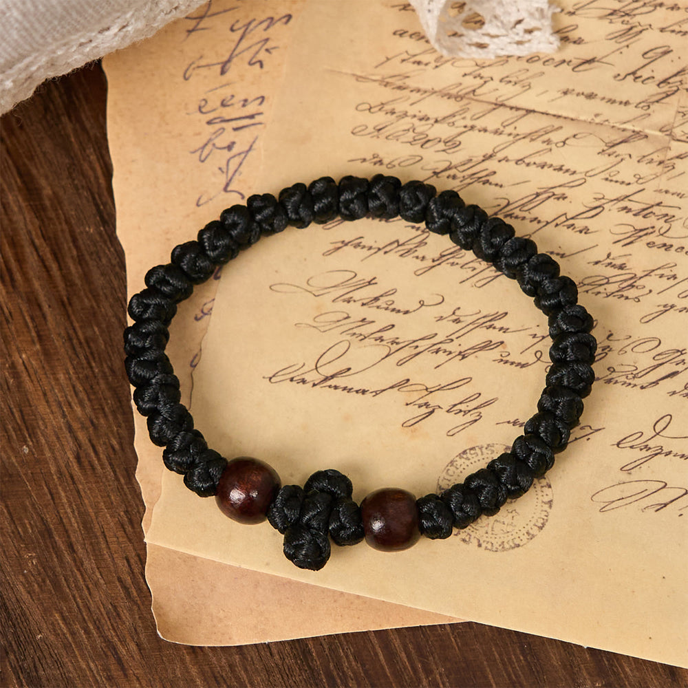 Christianartworkshop Bracciale con nodo a croce blu e nera: un segno di fede - image 1