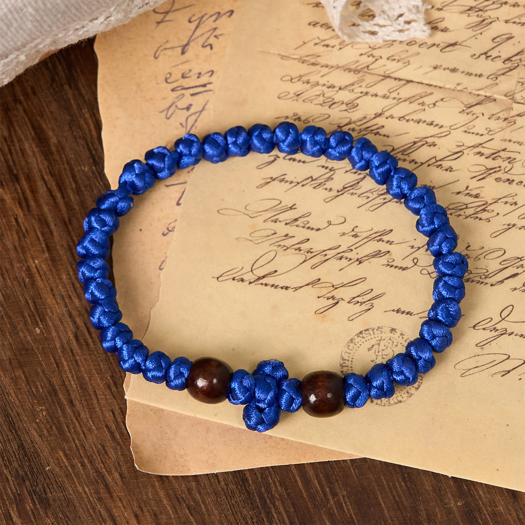 Christianartworkshop Bracciale con nodo a croce blu e nera: un segno di fede - image 0