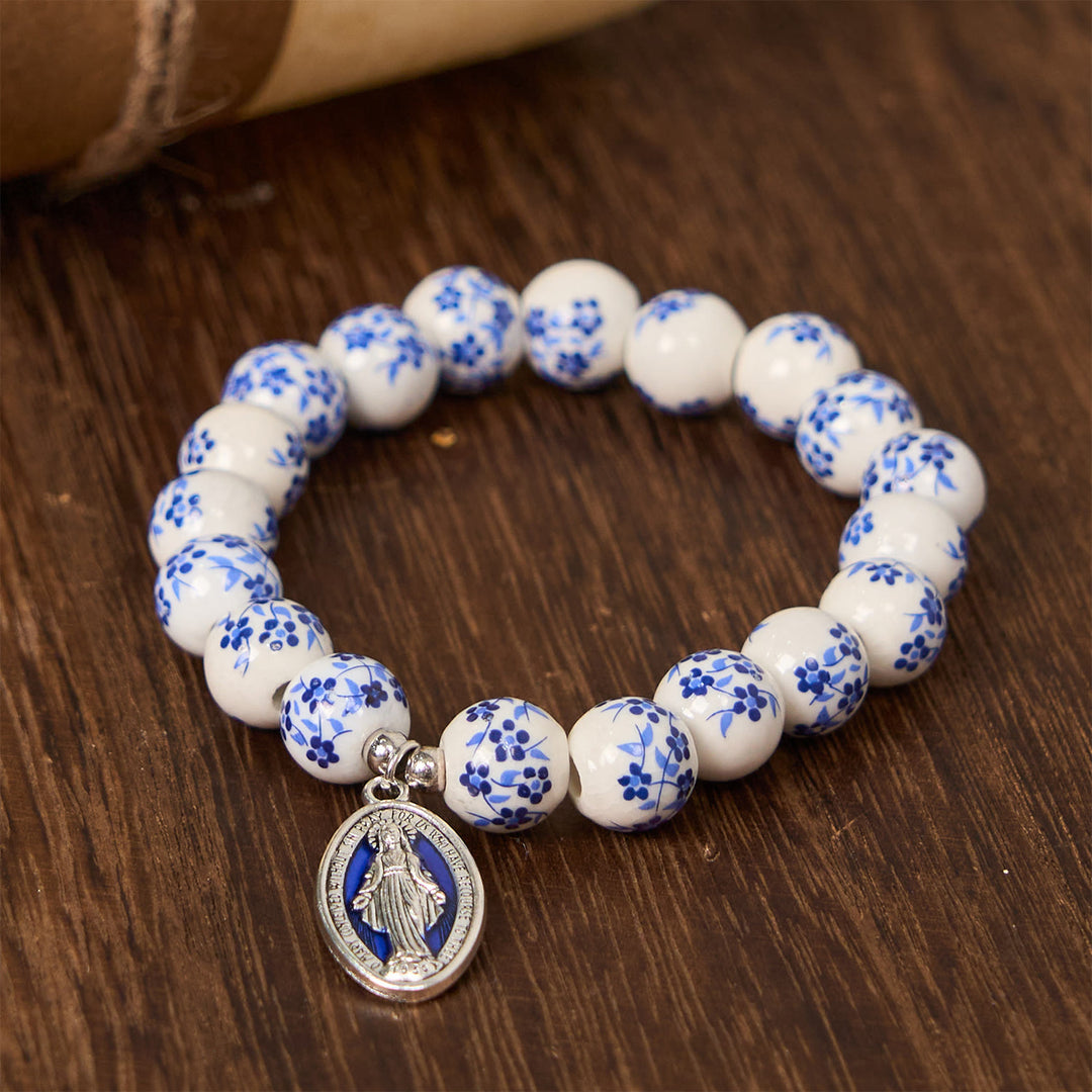 Christianartworkshop Bracciale floreale con perline blu e bianche e medaglia miracolosa - image 0