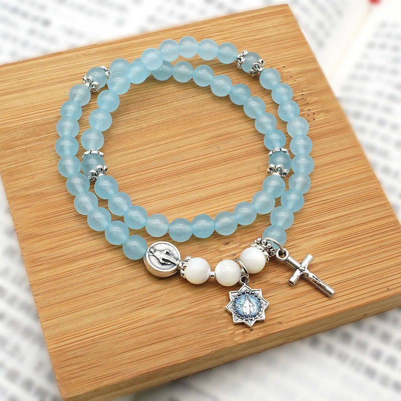 Bracciale minimalista con medaglia miracolosa e crocifisso con perline azzurre da 6 mm Christianartworkshop : un simbolo di fede - Crocifisso e medaglia miracolosa - image 0