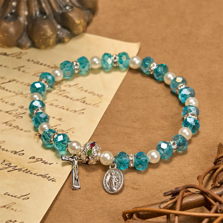 Christianartworkshop Bracciale elastico moderno in cristallo trasparente con crocifisso e medaglia miracolosa: dichiarazione di fede contemporanea - Lago Blu - image 0