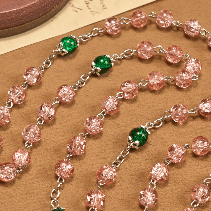 Rosario in lega con perline di vetro rosa scintillanti trasparenti di Christianartworkshop con la Madonna e la croce Ankh - image 5