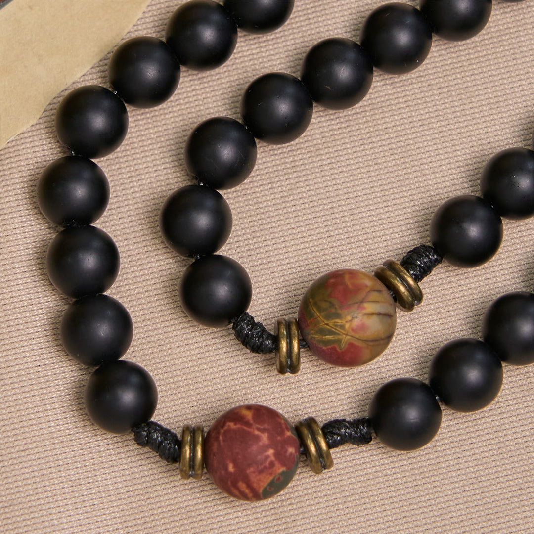 Rosario artigianale nero opaco e nei toni della terra raffigurante San Benedetto, realizzato da Christianartworkshop - image 7