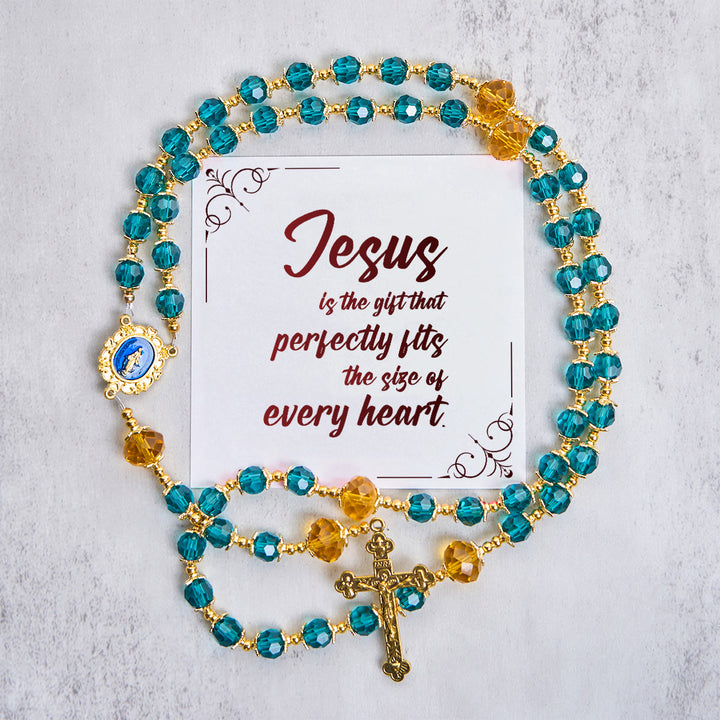Christianartworkshop Jesus Is The Gift: Rosario fatto a mano con perline di cristallo blu pavone e carta regalo - Gesù è il Dono - image 0