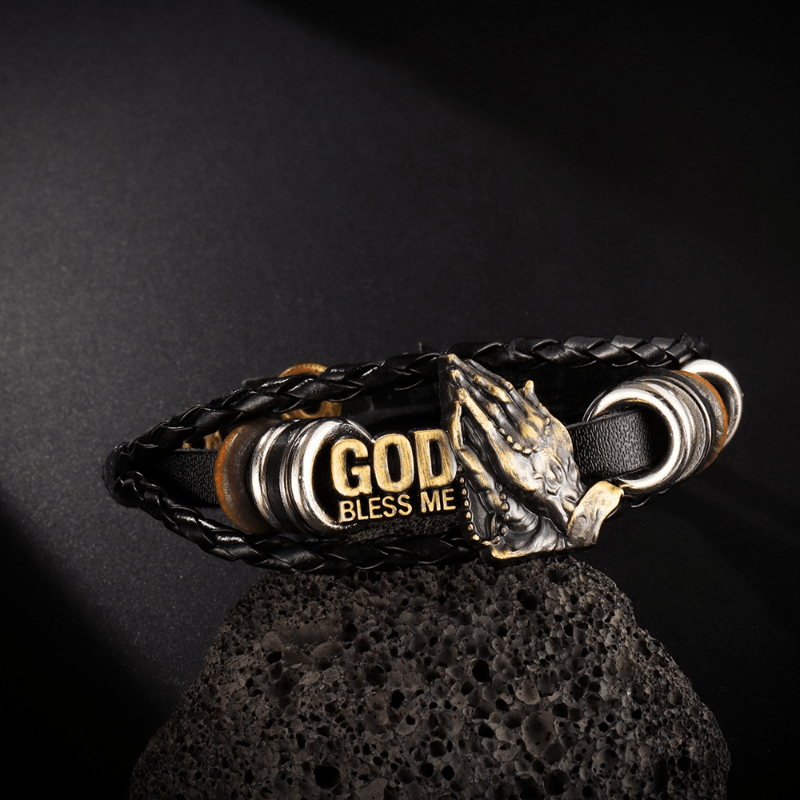 Christianartworkshop Braccialetto con mani in preghiera in stile retrò, DIO MI BENEDICA, design intrecciato nero - Circonferenza del polso: 8,66''/22 cm - image 0