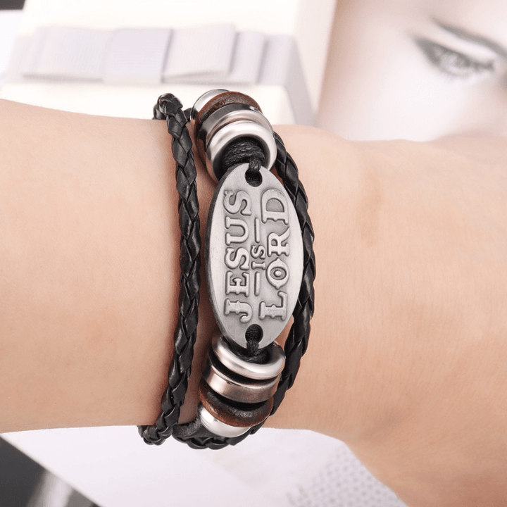 Christianartworkshop Bracciale in pelle intrecciata nera con iscrizione JESUS ​​IS LORD - image 1