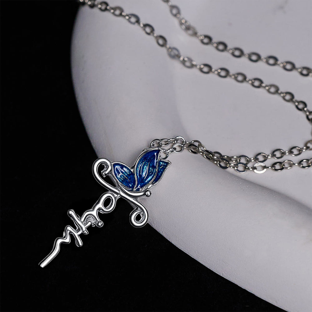 Set di gioielli con croce a farfalla di Christianartworkshop: devozione e simbolismo artistico - image 1