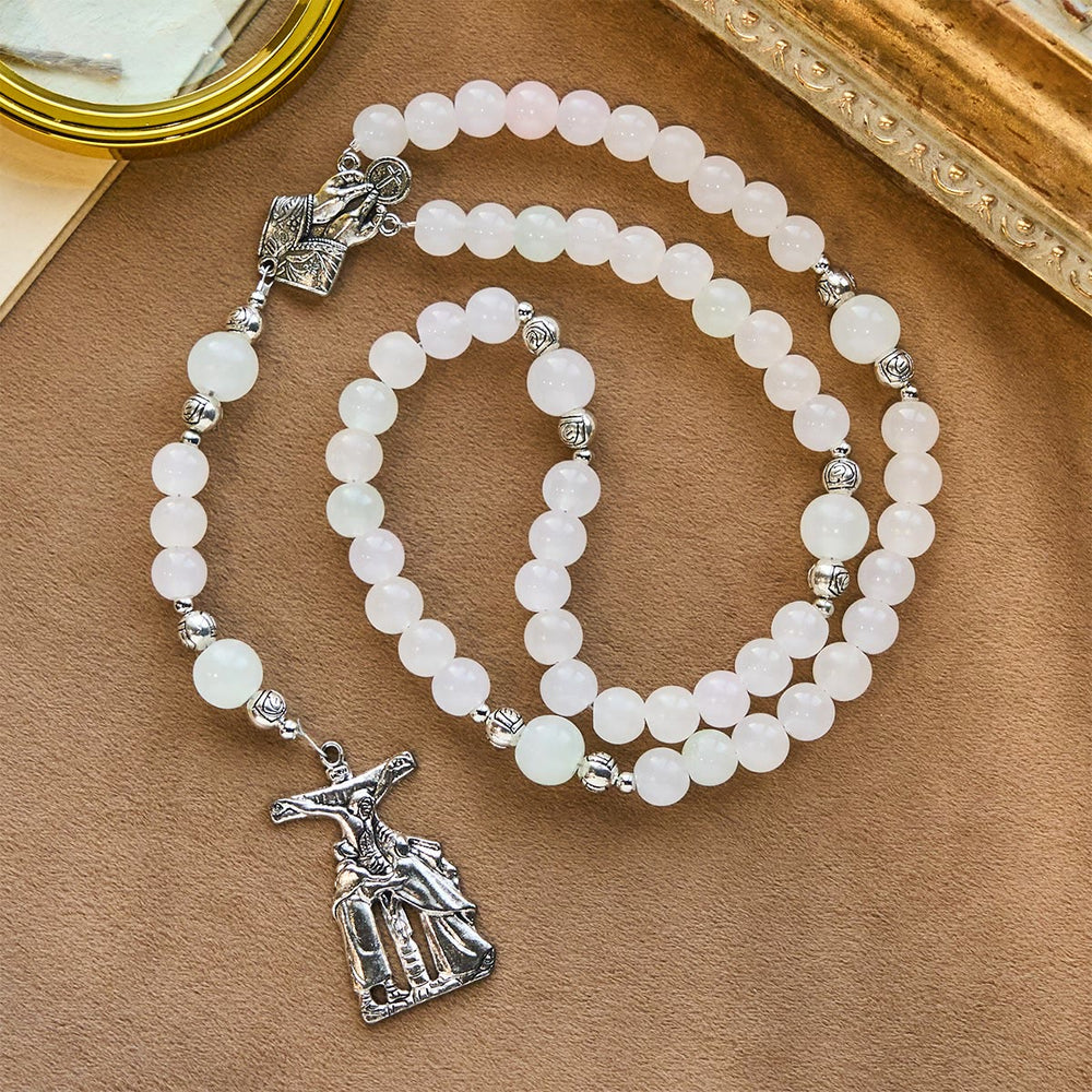 Rosario pastello con crocifisso e mani in preghiera che cambiano colore con luce UV di Christianartworkshop - image 1