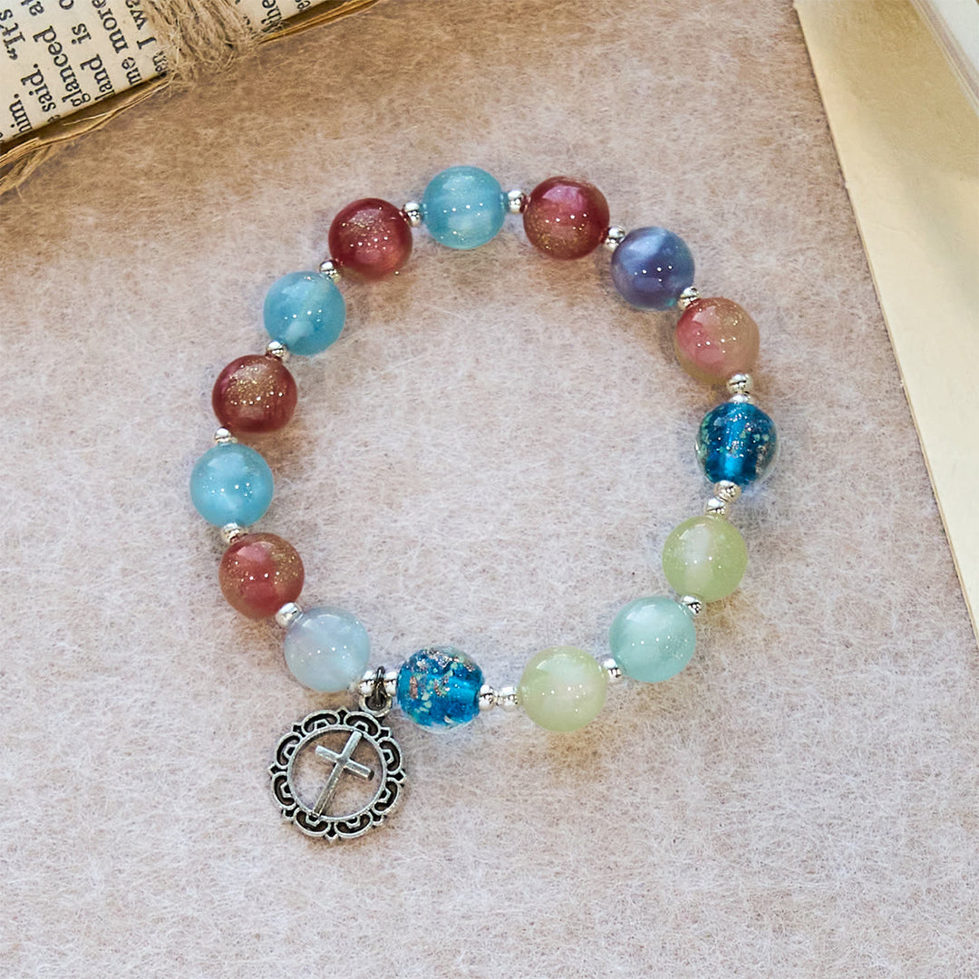 Bracciale con perline glitterate che cambiano colore ai raggi UV di Christianartworkshop con croce decorata: brilla in tonalità fedeli - Circonferenza del polso: 7,87''/20 cm (regolabile) - image 0