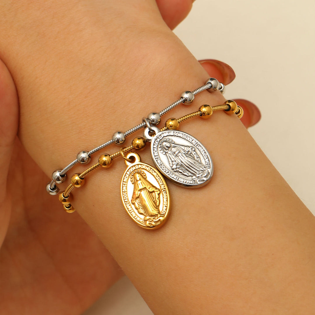 Bracciale con medaglia della Madonna e croce Christianartworkshop : promemoria di fede e cura da indossare ogni giorno - image 0