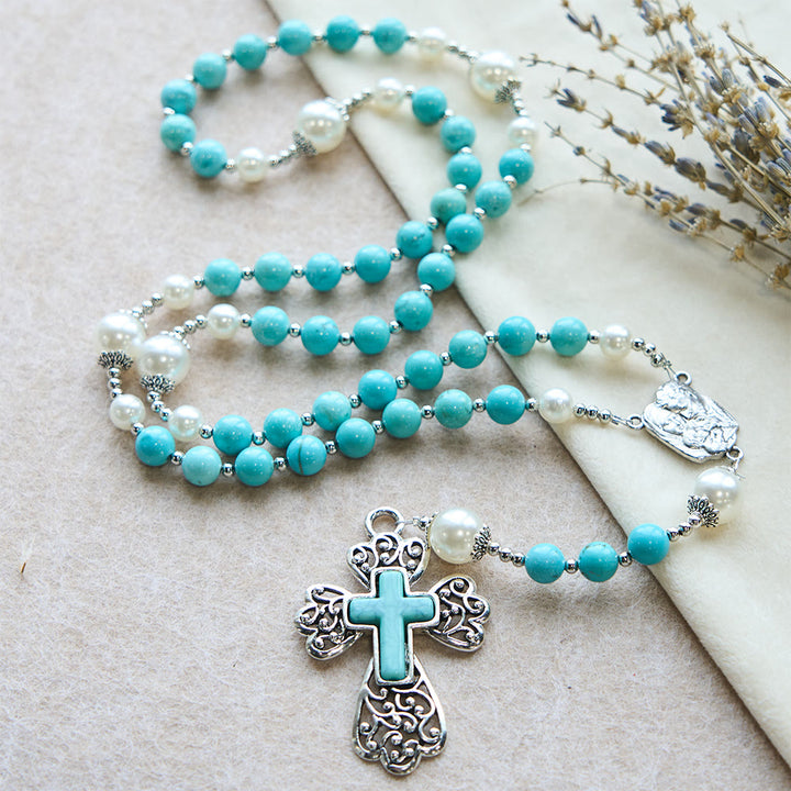Rosario con crocifisso in perline turchesi di Christianartworkshop con accento della Sacra Famiglia: un promemoria costante della Sua grazia - image 3
