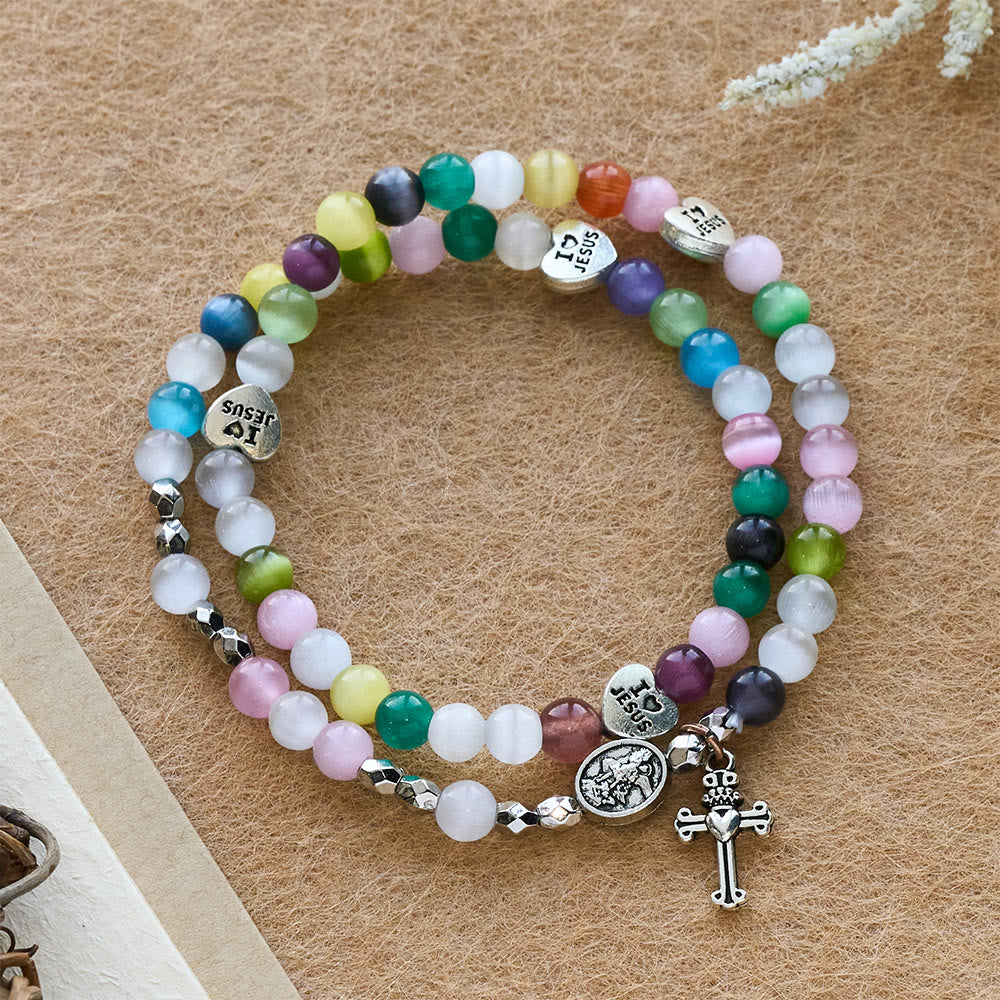 Christianartworkshop Braccialetto con perline multicolore a forma di occhio di gatto (collana per bambini) con medaglie "I Love Jesus" e "Arcangelo" - Medaglia Croce e Angelo - image 0
