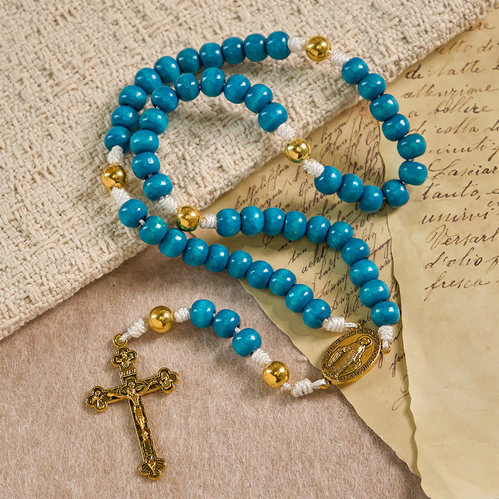 Christianartworkshop Rosario con perline di legno blu e medaglione della Madonna: simbolo di grazia e fede divina. - image 2