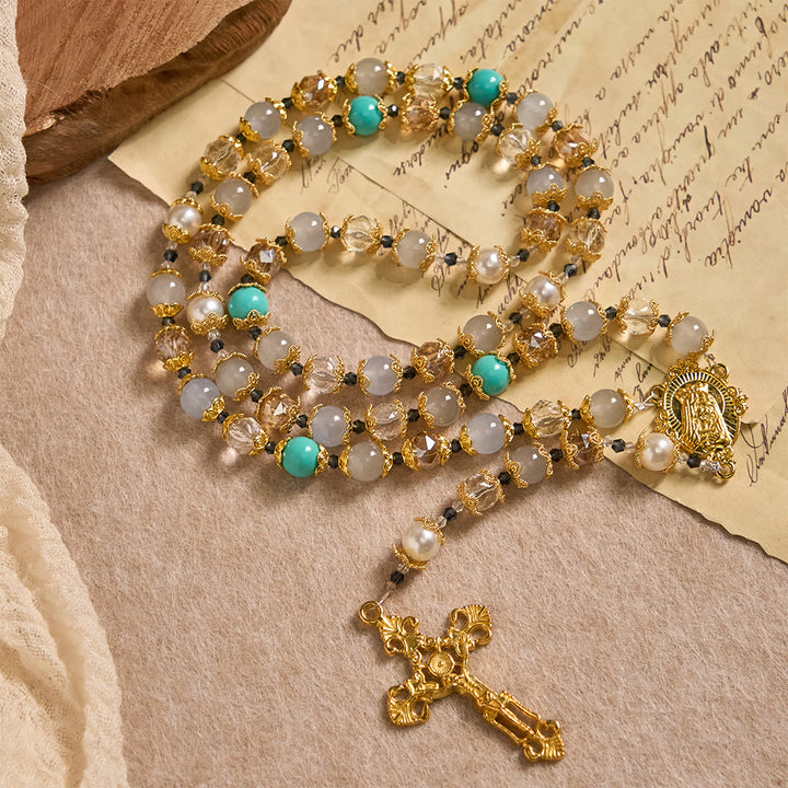 Christianartworkshop Rosario con perle di vetro blu, medaglia della Madonna e crocifisso: simbolo di grazia in ogni preghiera. - Nostra Signora e il Crocifisso - image 0