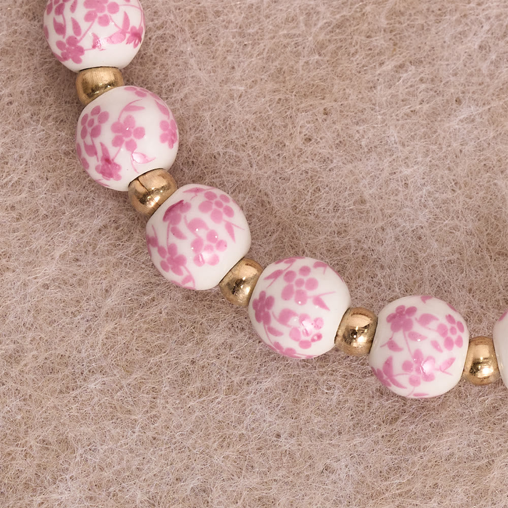 Christianartworkshop Bracciale in ceramica blu/rosa con motivo floreale e grande perlina bianca decorativa: un promemoria della grazia divina. - image 3