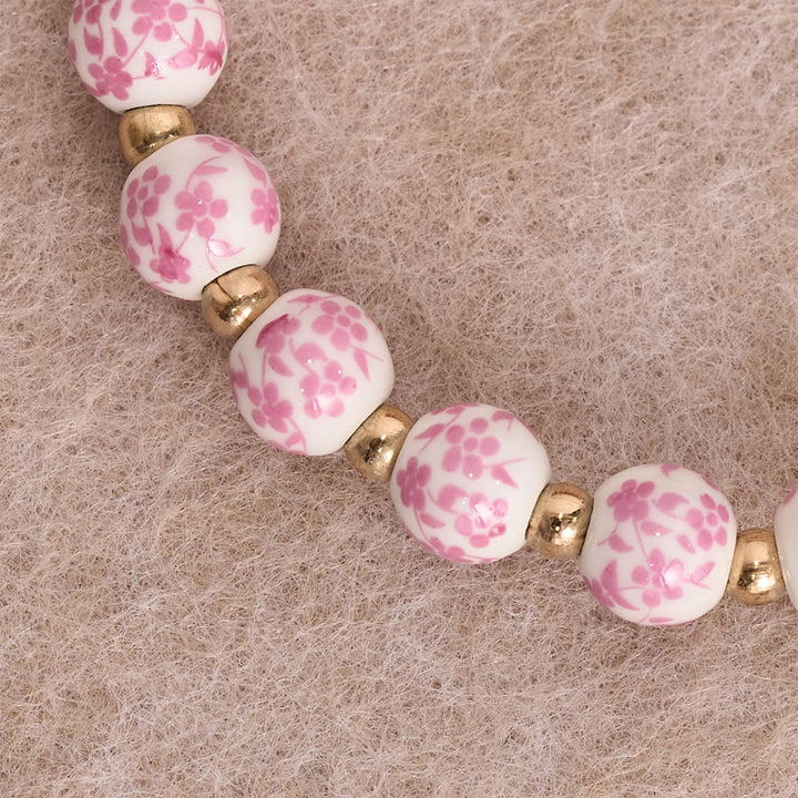 Christianartworkshop Bracciale in ceramica blu/rosa con motivo floreale e grande perlina bianca decorativa: un promemoria della grazia divina. - image 3