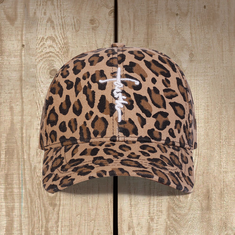 Christianartworkshop Cappellino da baseball unisex con stampa leopardata e ricamo a croce in corsivo "Faith", effetto lavato. - image 0
