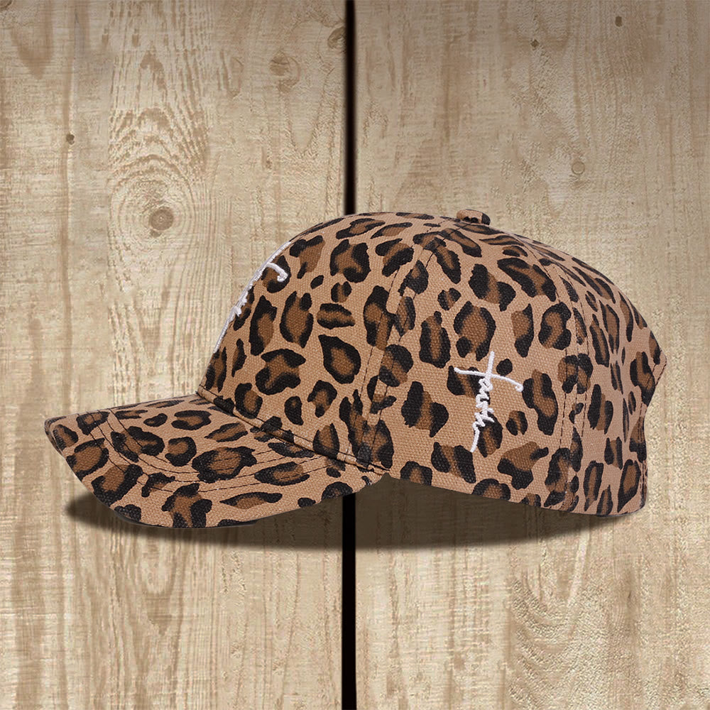 Christianartworkshop Cappellino da baseball unisex con stampa leopardata e ricamo a croce in corsivo "Faith", effetto lavato. - image 1
