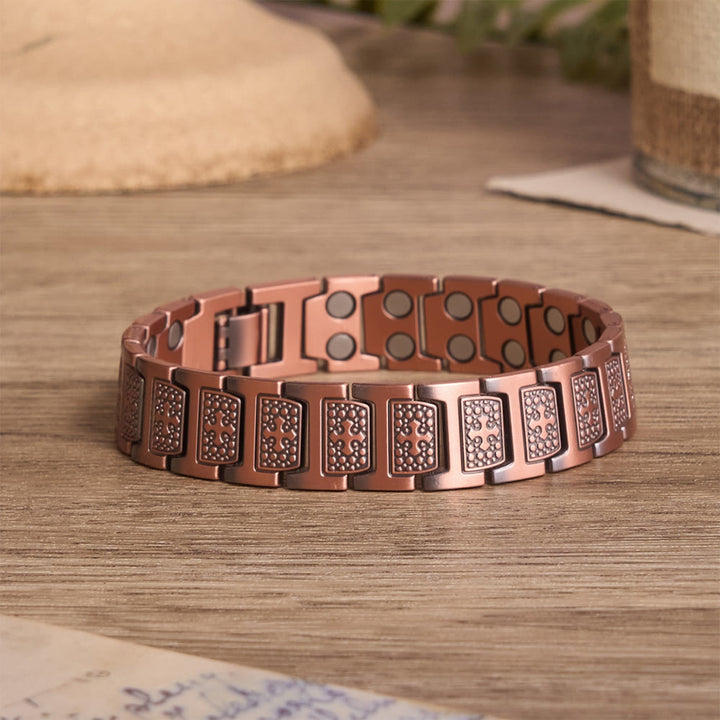 Christianartworkshop Bracciale rettangolare a maglie solide con croce incisa incorniciata da perline a bolla e chiusura regolabile pieghevole. - Bronzo - image 0
