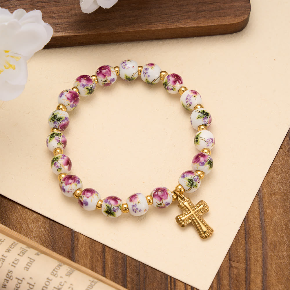 Christianartworkshop Bracciale elastico in ceramica con perline floreali in 4 stili e ciondolo a croce color oro: simbolo di dolce grazia celeste. - Viola - image 0