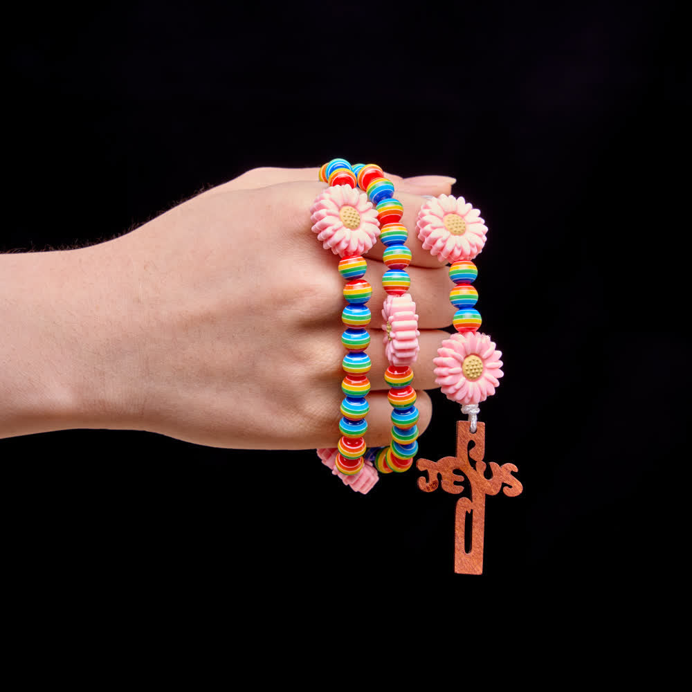 Christianartworkshop Rosario per bambini con perline a strisce arcobaleno, nodi a margherita rosa e croce di Gesù. - image 1