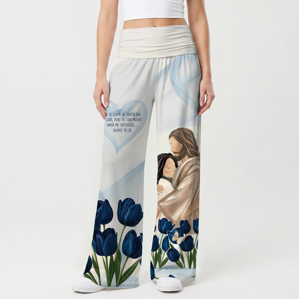 Christianartworkshop Pantaloni da donna a gamba larga con stampa floreale e scritta in spagnolo "Abbraccia Gesù" con tulipani blu e motivi floreali, ideali per uno stile casual e di fede. - image 1