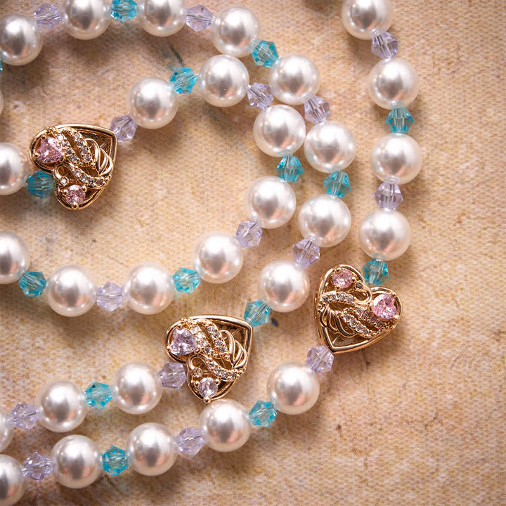Christianartworkshop Rosario lucido con perle artificiali, ciondoli a forma di cigno e cuore con strass, medaglia della Madonna e crocifisso gioiello. - image 5