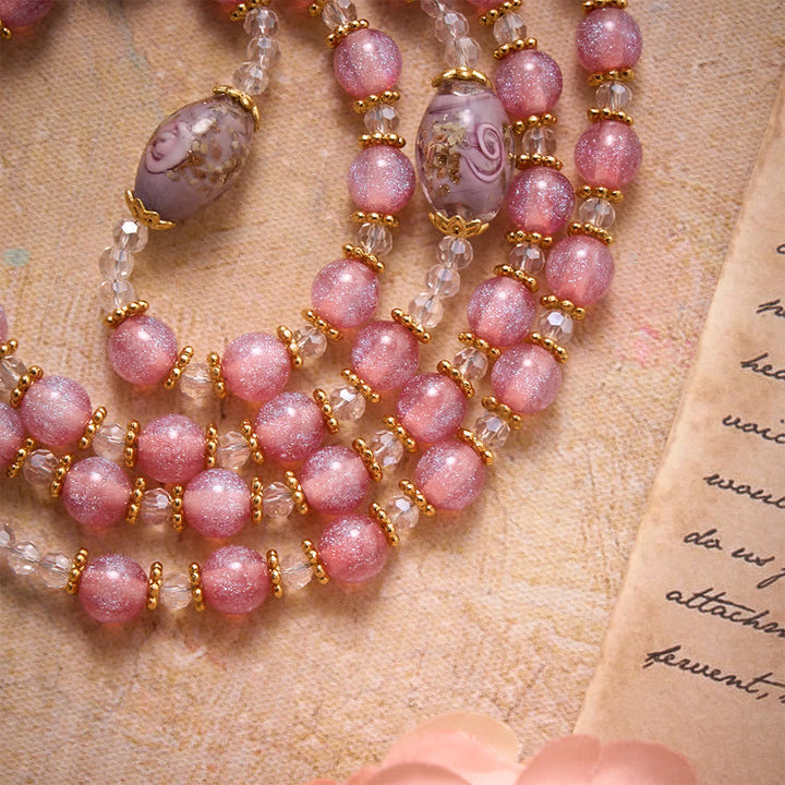 Christianartworkshop Rosario di lusso con perline di vetro rosa glitterate a forma di fiore, ciondolo a forma di cuore della Madonna e croce dorata: emblema di dolce purezza celeste. - image 5