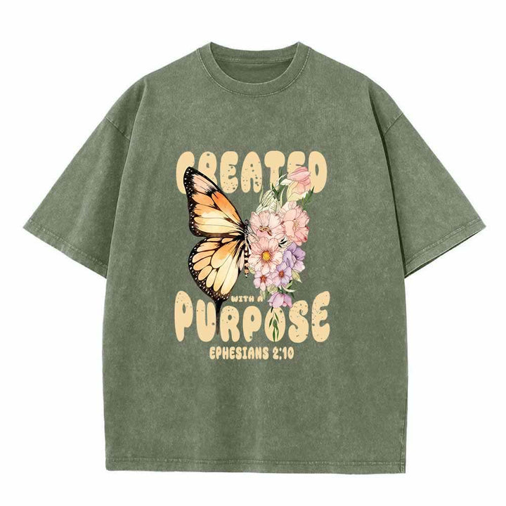 Christianartworkshop Maglietta lavata con stampa frontale "Created With A Purpose" raffigurante una farfalla monarca e un fiore selvatico pastello, ispirata a Efesini 2:10. - Verde militare - 5XL - image 1