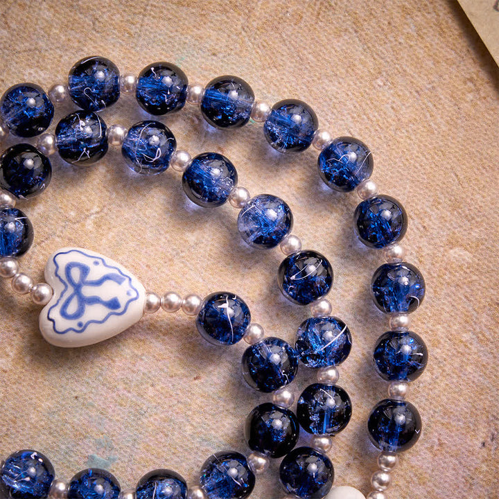 Christianartworkshop Rosario in vetro blu craquelé con perline a forma di cuore in ceramica e medaglia della Madonna. - image 8