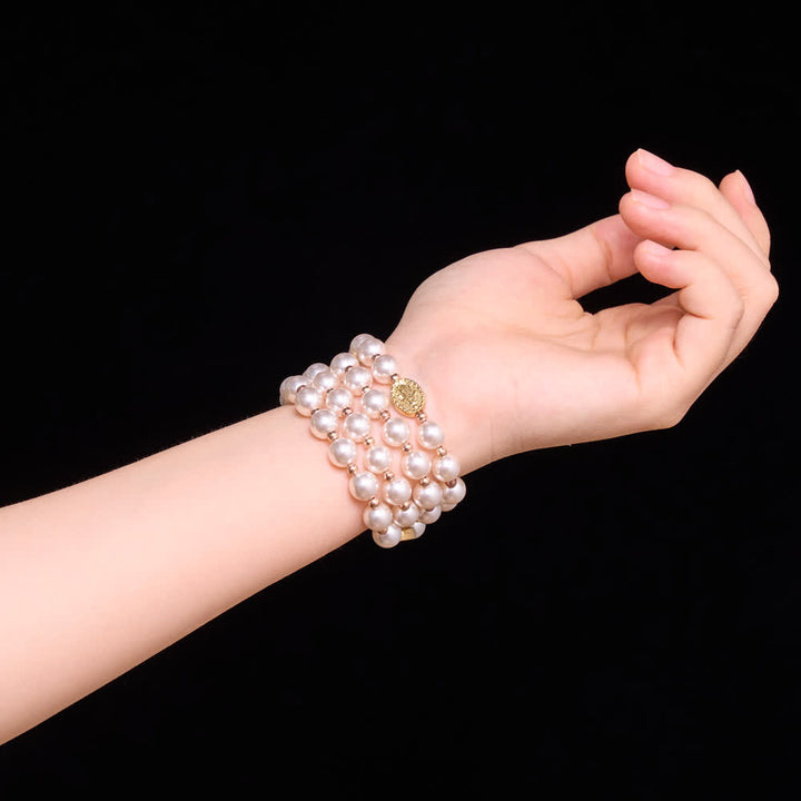 Christianartworkshop Bracciale rosario con perle a più anelli e medaglia della Madonna in rilievo: emblema della dolce misericordia celeste. - image 1