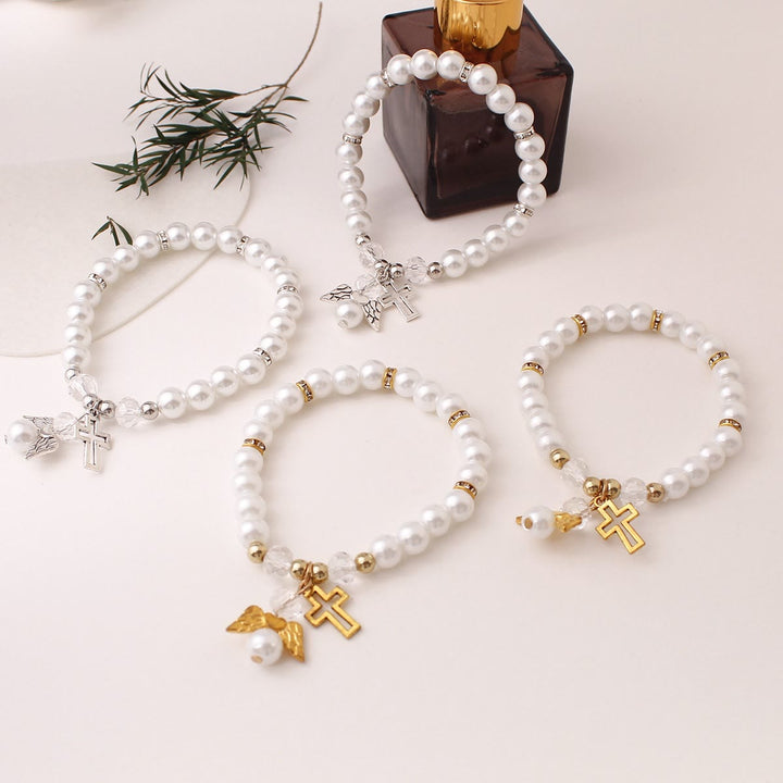 Christianartworkshop Bracciale elastico con croce e perline di perle lucenti: emblema di pura purezza celeste. - image 1