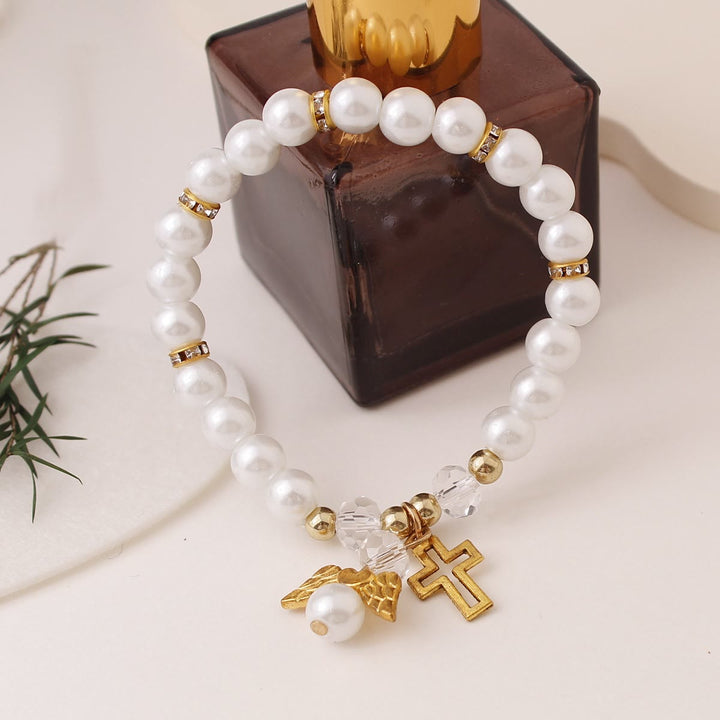 Christianartworkshop Bracciale elastico con croce e perline di perle lucenti: emblema di pura purezza celeste. - D'oro - image 0