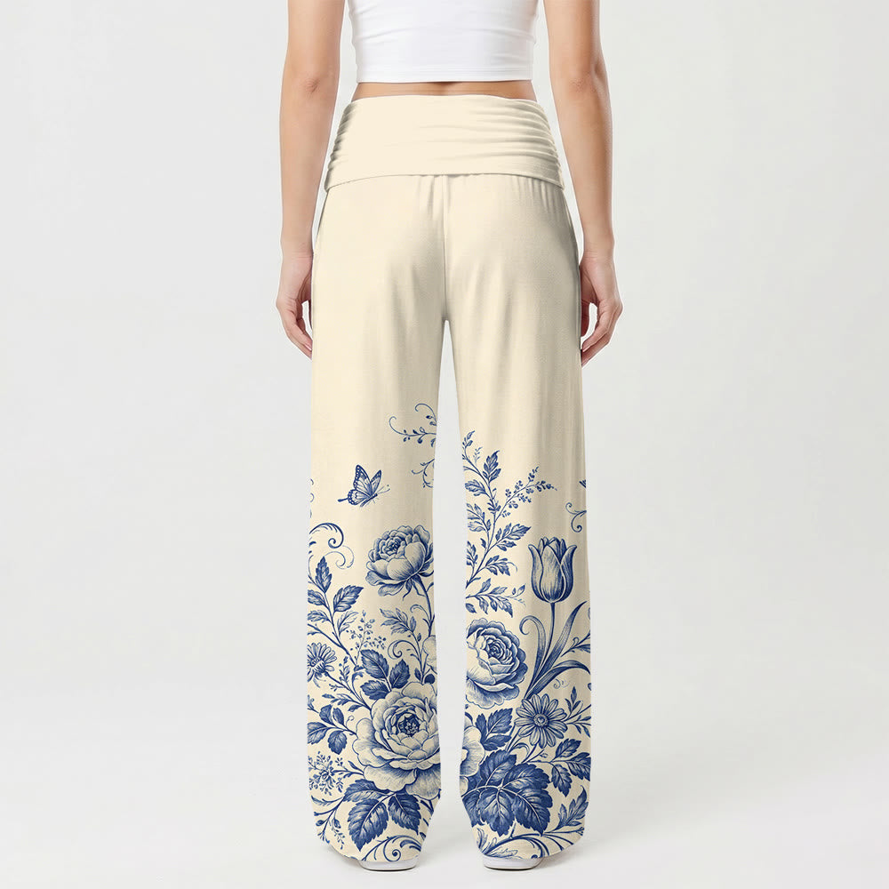 Christianartworkshop Pantaloni da donna a gamba larga con motivo floreale blu e croce decorativa. - image 1
